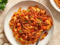 A bowl of Dairy Free Bolognese tossed with pasta.