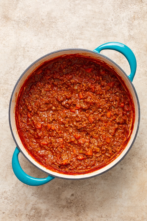 Dairy Free Bolognese Sauce in a teal dutch oven.