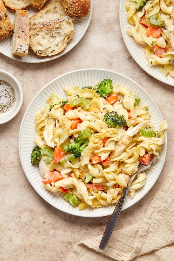 A serving of Dairy Free Creamy Chicken Noodle Casserole on a plate with a fork.