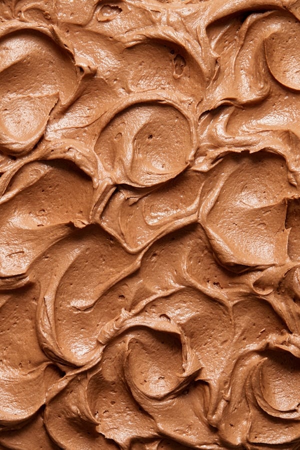 Close up view of swoops of Dairy Free Chocolate Buttercream Frosting.