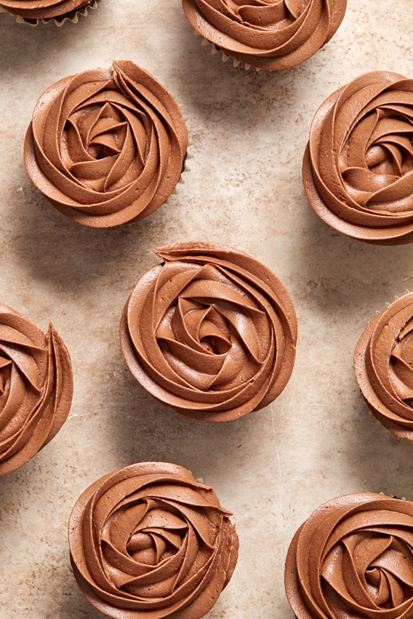 Dairy Free Chocolate Buttercream piped onto cupcakes.