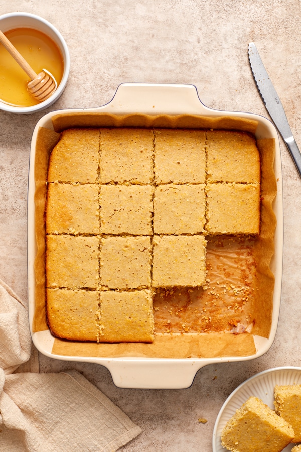 A pan of Dairy Free Gluten Free Cornbread sliced in the baking dish.