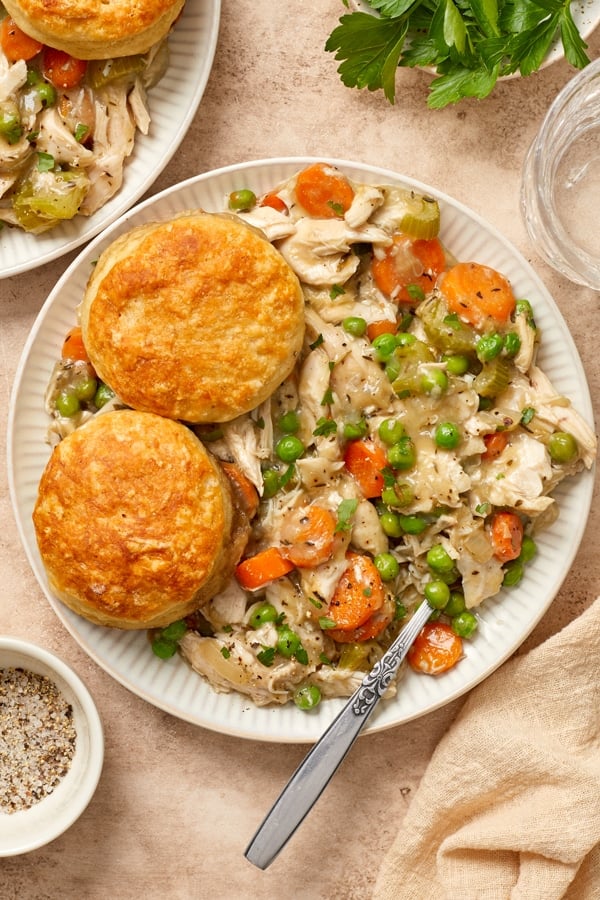 A white plate filled with Dairy Free Chicken Pot Pie Casserole and a fork.