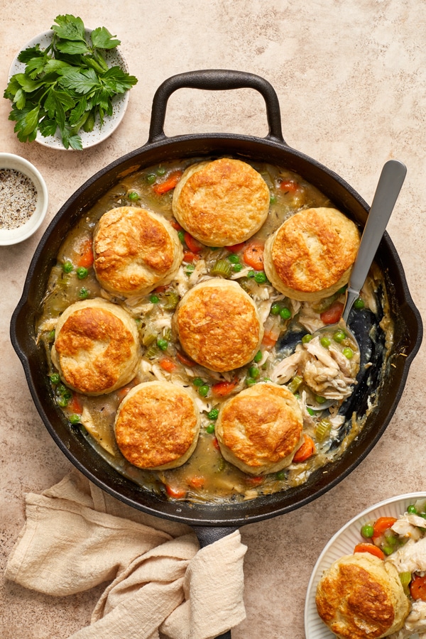 A black skillet filled with Dairy Free Chicken Pot Pie with Biscuits.