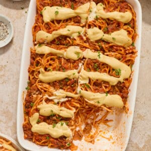 A white baking dish filled with Dairy Free Baked Spaghetti.