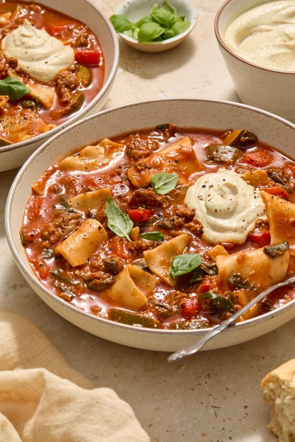 Two bowls of Dairy Free Lasagna Soup with spoons.